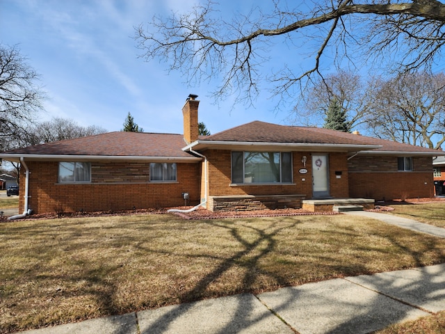 ranch-style house with brick siding and a front lawn