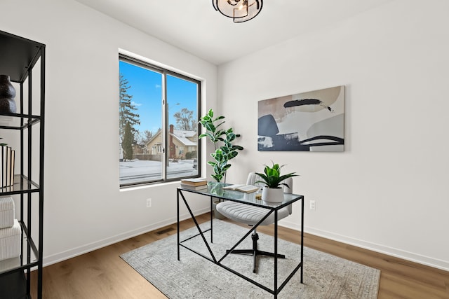 office area with hardwood / wood-style floors