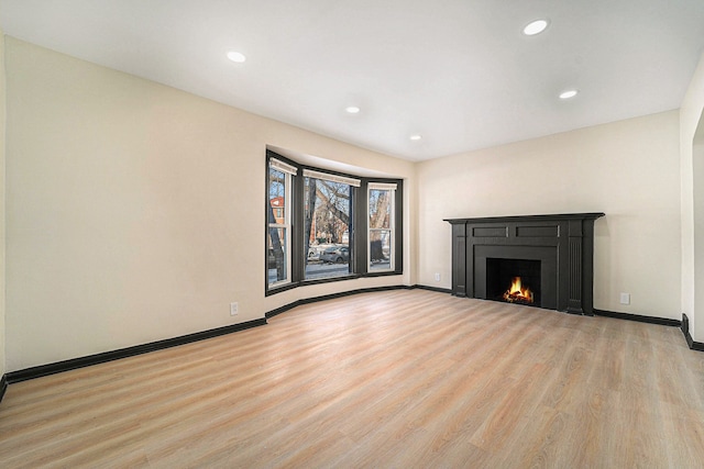 unfurnished living room featuring light hardwood / wood-style flooring