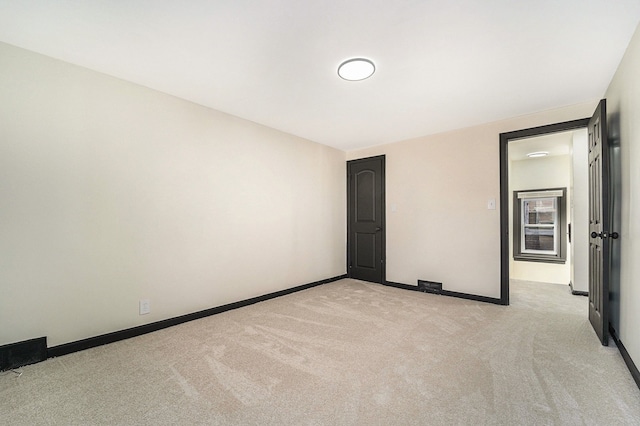 unfurnished bedroom with light carpet