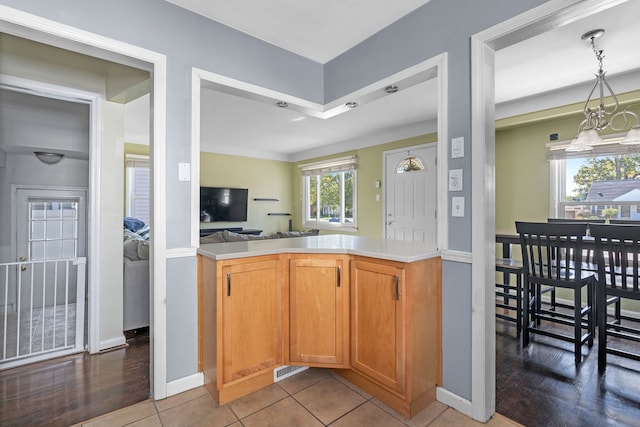 kitchen with tile patterned flooring and kitchen peninsula