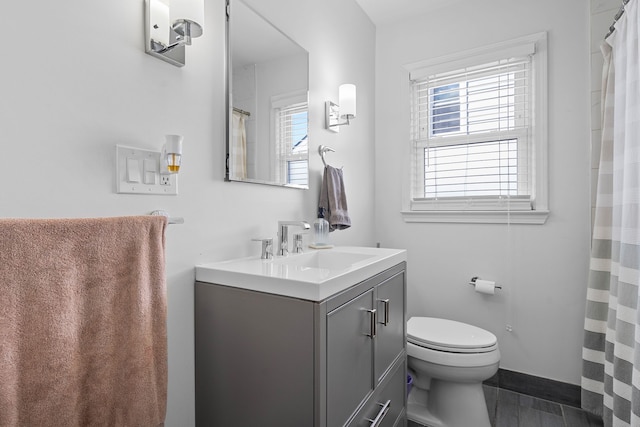 bathroom with vanity and toilet