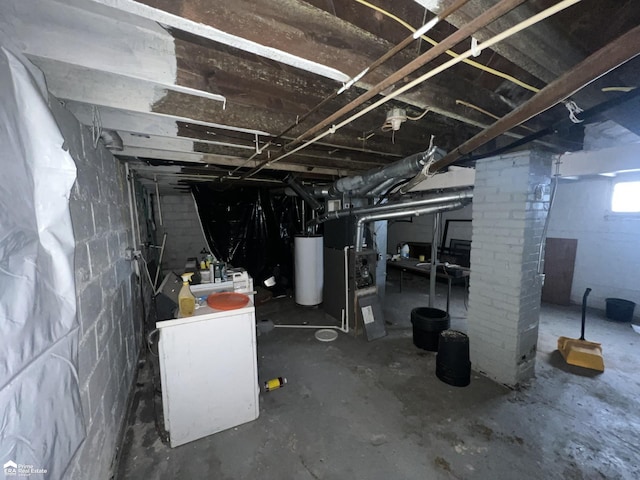 basement featuring heating unit and water heater