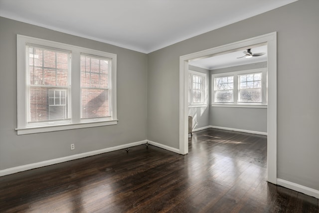 spare room featuring dark wood-type flooring