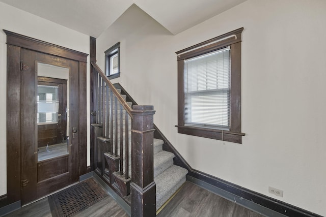 stairway featuring hardwood / wood-style flooring