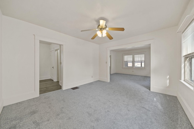 carpeted empty room with ceiling fan