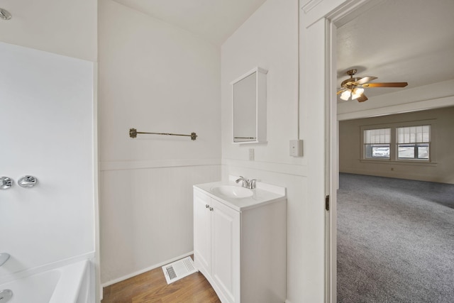 bathroom with vanity and ceiling fan