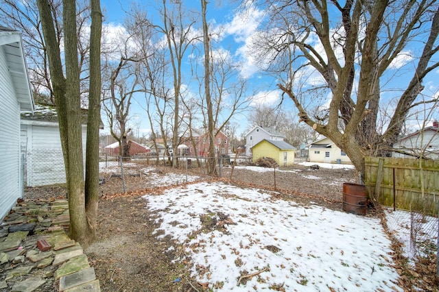 view of yard layered in snow