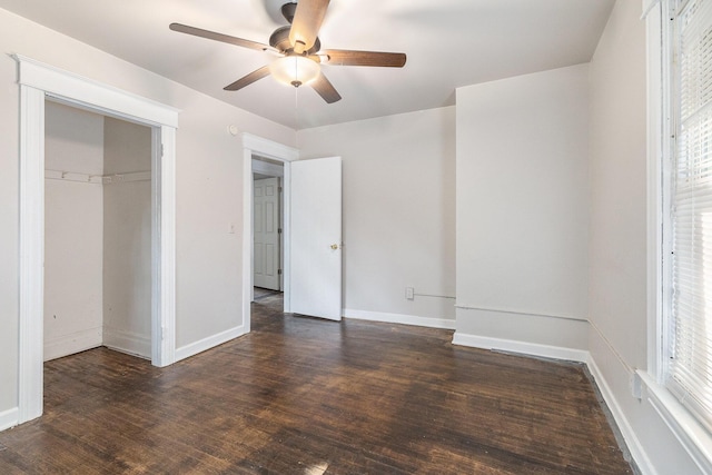 unfurnished bedroom featuring dark hardwood / wood-style flooring, a closet, and ceiling fan