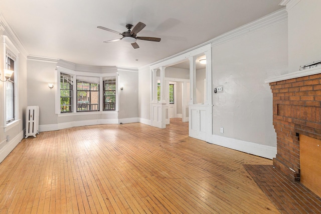 unfurnished living room featuring radiator, crown molding, light hardwood / wood-style flooring, and ceiling fan