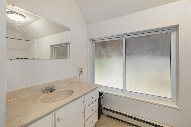 bathroom featuring a baseboard radiator, lofted ceiling, bathing tub / shower combination, and vanity