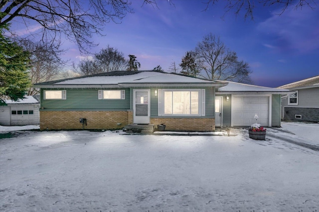 ranch-style home featuring a garage