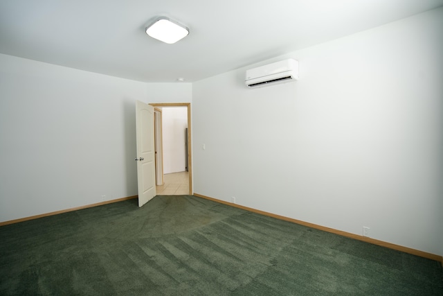 unfurnished room featuring a wall mounted air conditioner and carpet flooring