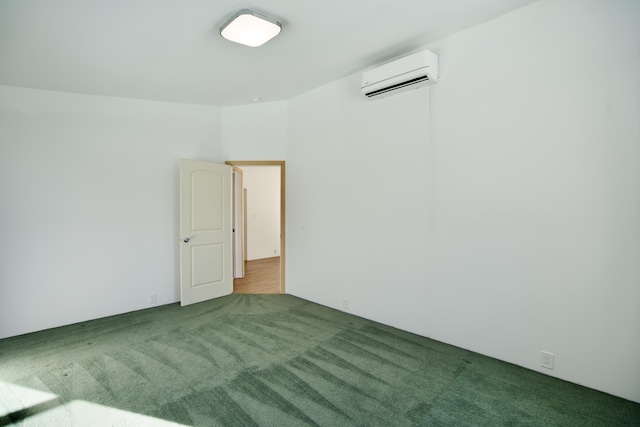 empty room with a wall unit AC and carpet