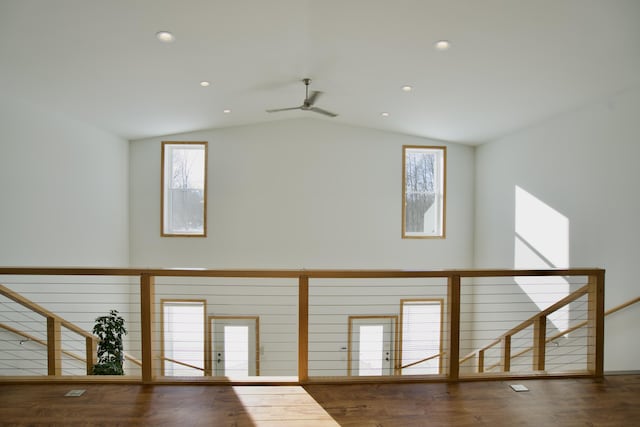 interior space featuring hardwood / wood-style flooring and lofted ceiling