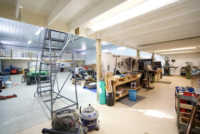 interior space with concrete flooring and a workshop area