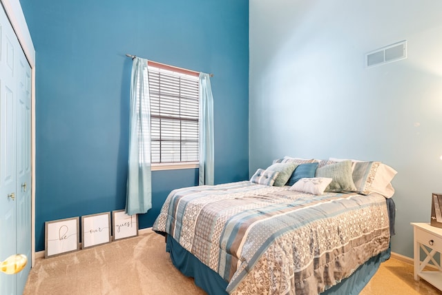 carpeted bedroom with a closet