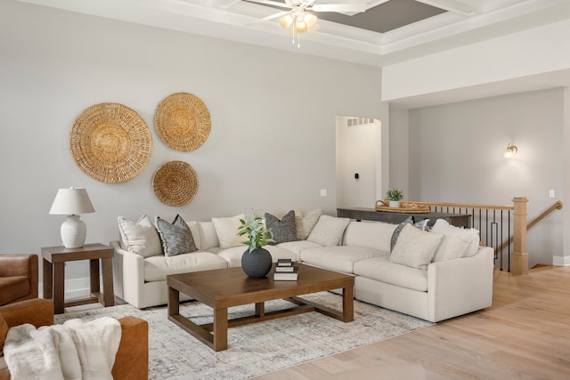 living room featuring coffered ceiling, light hardwood / wood-style flooring, and ceiling fan