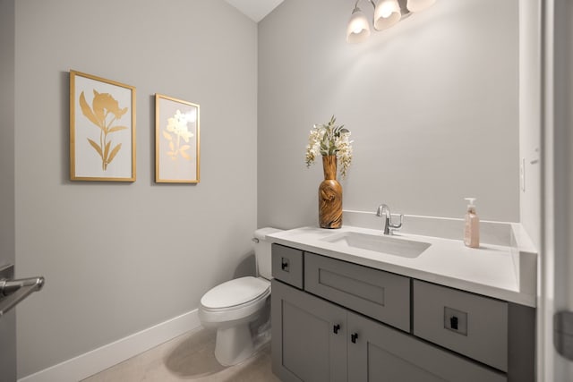 bathroom with vanity, tile patterned floors, and toilet