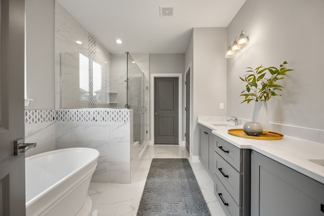 bathroom featuring vanity and separate shower and tub