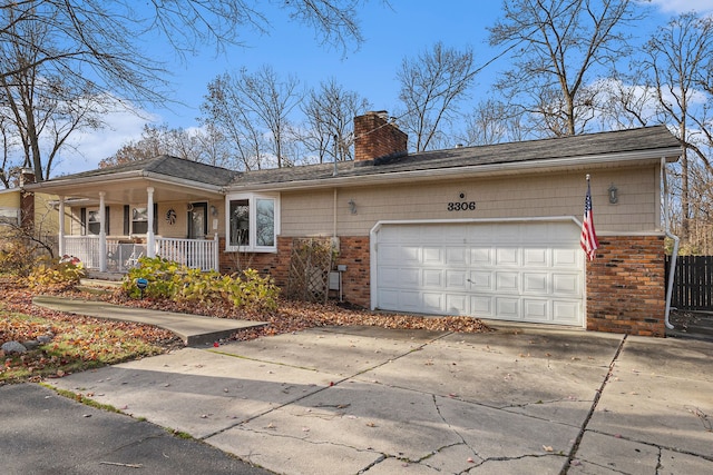 single story home featuring a porch and a garage