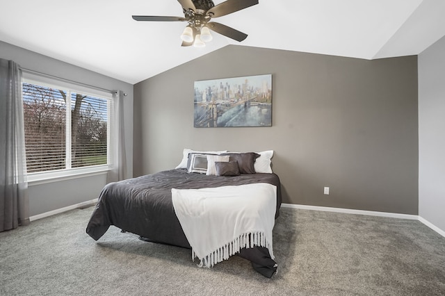 bedroom with vaulted ceiling, ceiling fan, and carpet flooring