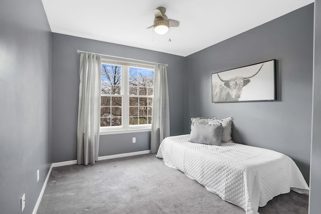 bedroom with ceiling fan and carpet floors