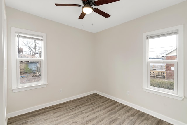 empty room featuring ceiling fan and light hardwood / wood-style flooring