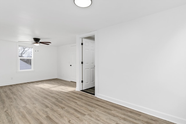 spare room with ceiling fan and light hardwood / wood-style floors