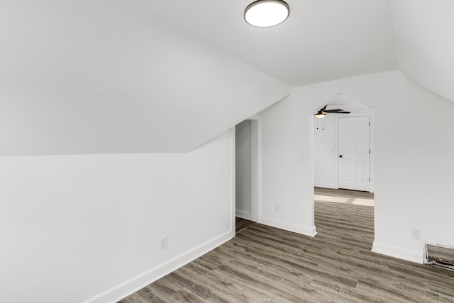 bonus room with vaulted ceiling, ceiling fan, and hardwood / wood-style floors