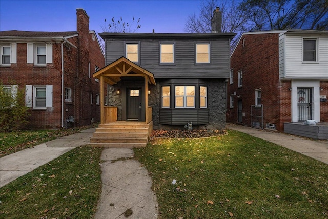 view of front of property with a yard