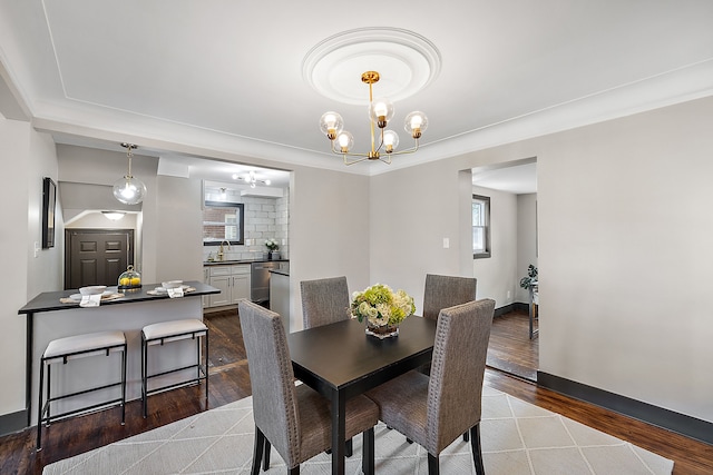 dining room with an inviting chandelier and hardwood / wood-style floors