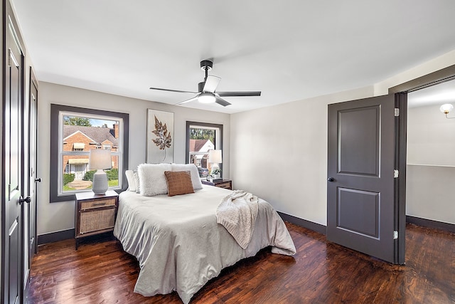 bedroom featuring dark wood-type flooring and ceiling fan