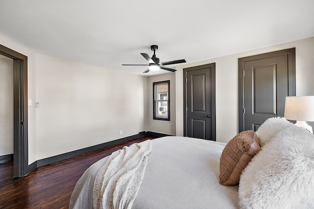 bedroom featuring ceiling fan and dark hardwood / wood-style floors