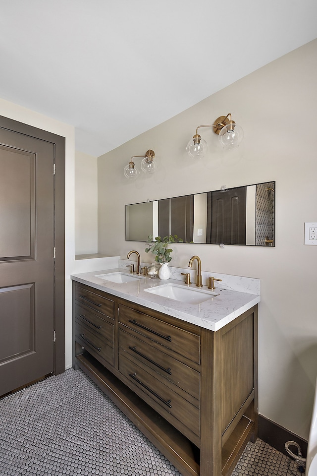 bathroom with tile patterned floors and vanity