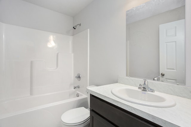 full bathroom featuring washtub / shower combination, vanity, and toilet