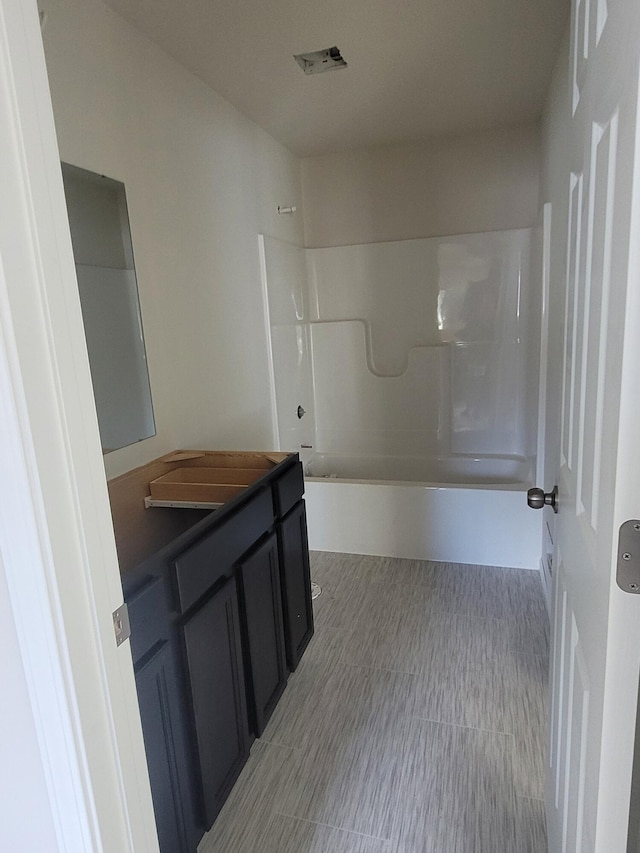 bathroom featuring vanity and shower / bathtub combination