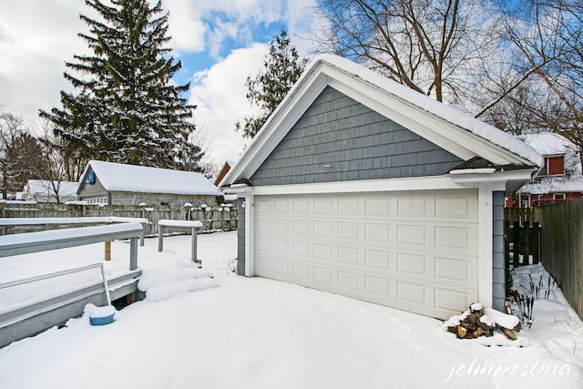 view of snow covered garage