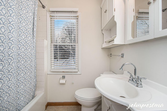 full bathroom featuring vanity, shower / tub combo with curtain, and toilet