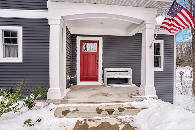 view of snow covered property entrance