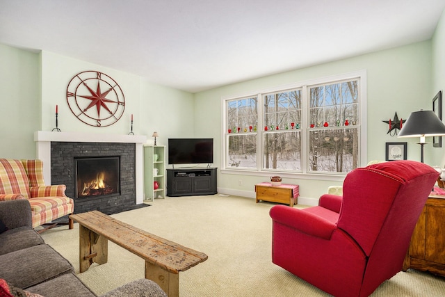 carpeted living room featuring a fireplace