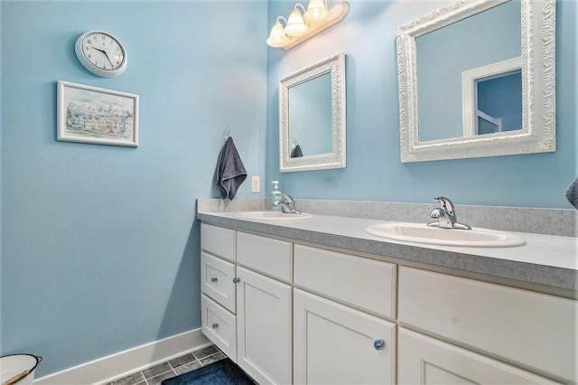 bathroom with tile patterned floors and vanity