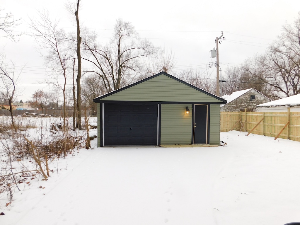 view of snow covered garage