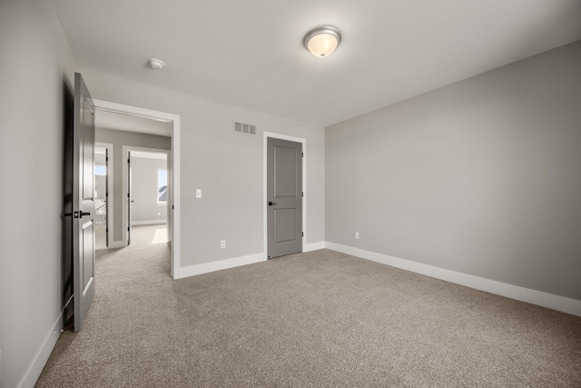 unfurnished bedroom with light carpet