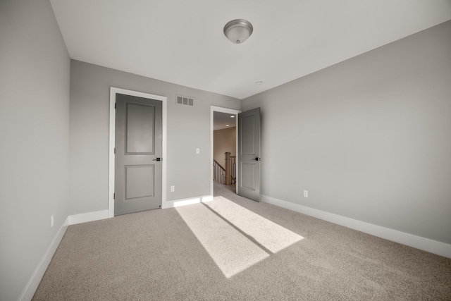 unfurnished bedroom featuring carpet