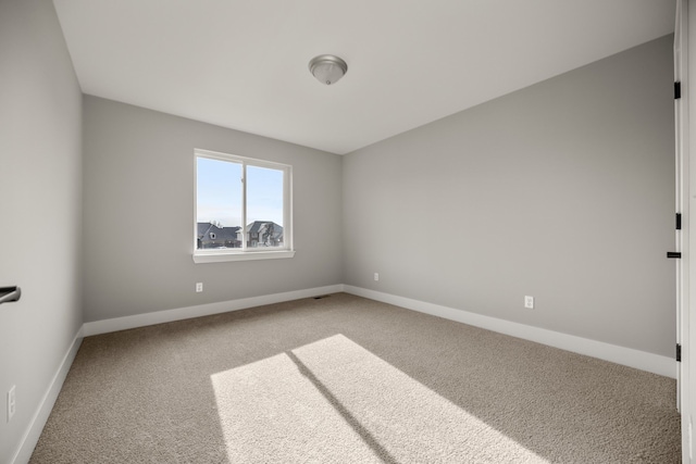 empty room with carpet flooring