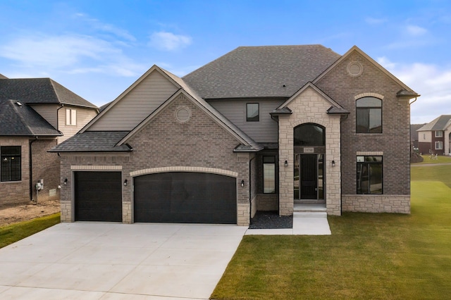 french provincial home with a garage and a front lawn