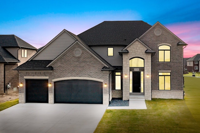 french country style house with a garage and a yard