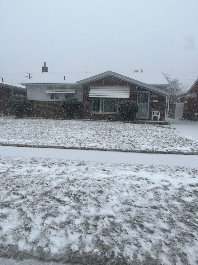 view of snow covered house