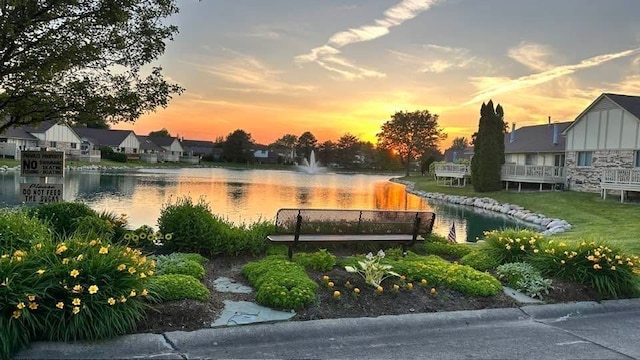 view of community with a water view